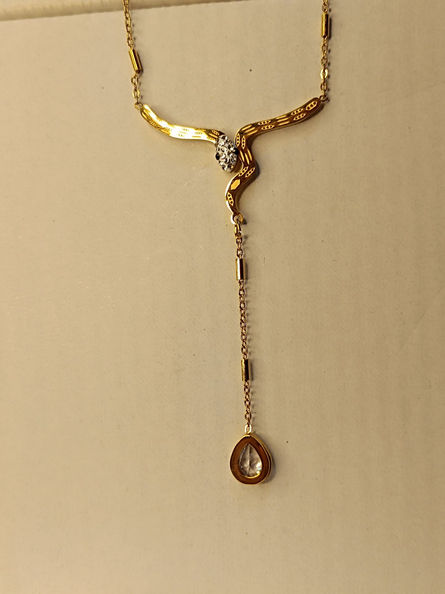 Elegant Snake-Inspired Gold Necklace with Crystal Accents